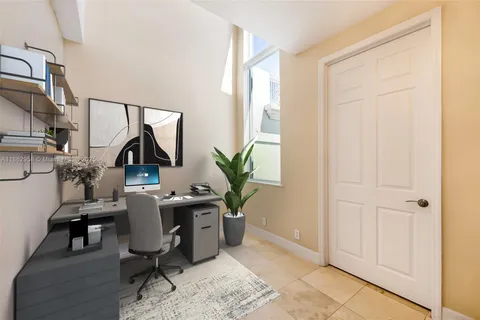 a view of a room with stairs and a window