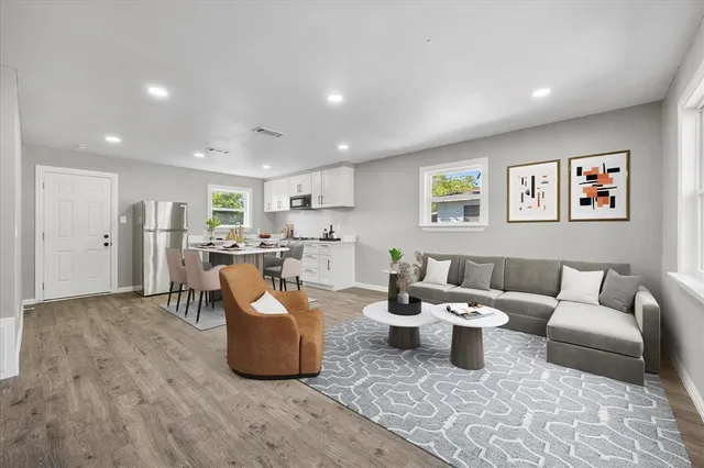 a living room with furniture and a table