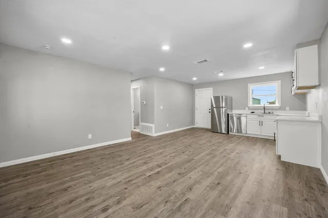 a view of kitchen with wooden floor