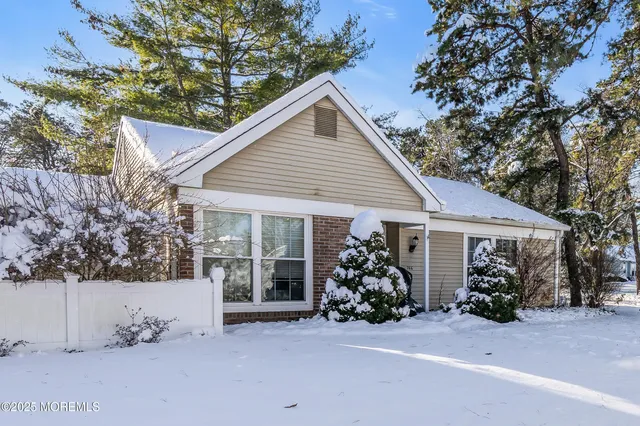 a view of a house with yard and a garden