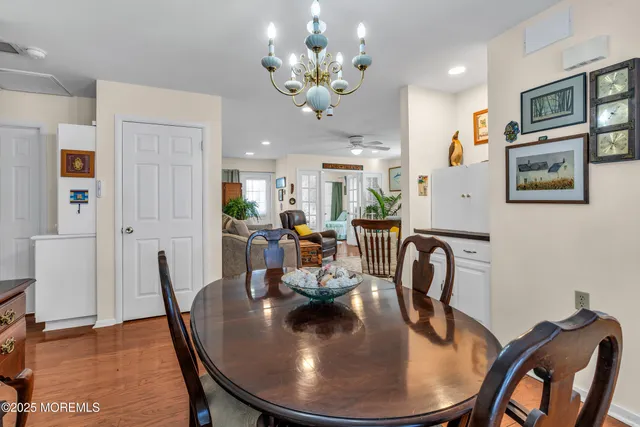 a dining room with furniture and wooden floor