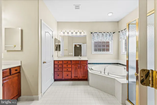a view of a livingroom with wooden floor and cabinet