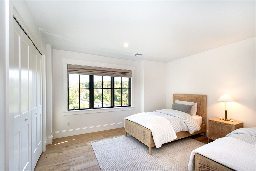 453 Clapp Road Scituate, MA 02066 - Photo 11 of 17 a bedroom with a bed and a night stand