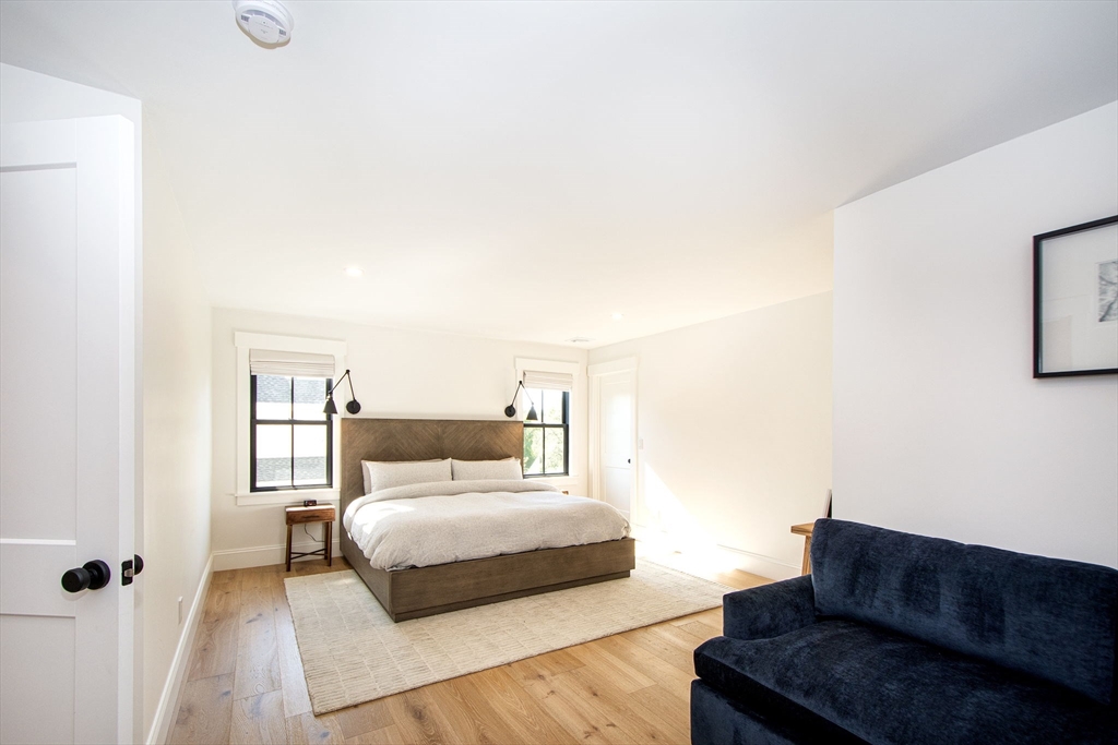 453 Clapp Road Scituate, MA 02066 - Photo 12 of 17 a bedroom with a bed and window