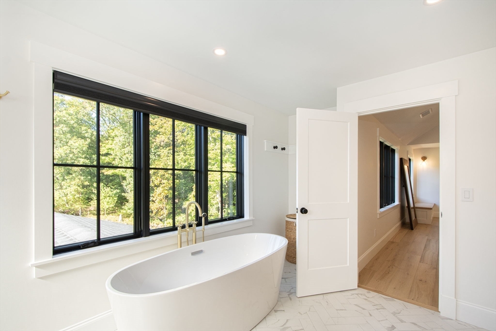 453 Clapp Road Scituate, MA 02066 - Photo 16 of 17 a bathroom with a bathtub and a sink