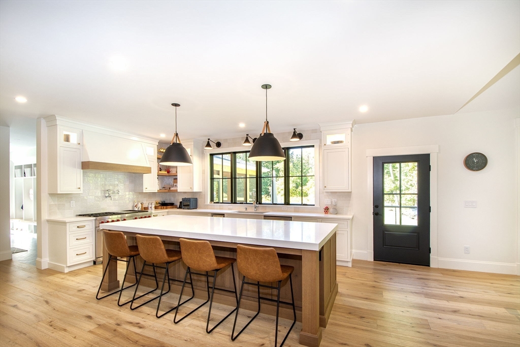 453 Clapp Road Scituate, MA 02066 - Photo 4 of 17 a kitchen with a table and chairs in it