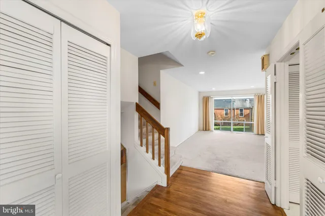 a view of an entryway with wooden floor