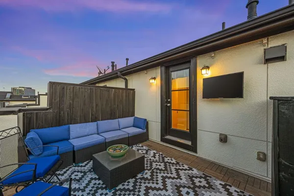 a view of a patio with a table and chairs