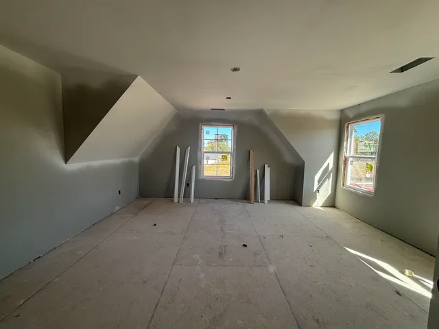 a view of a big room with windows and closet