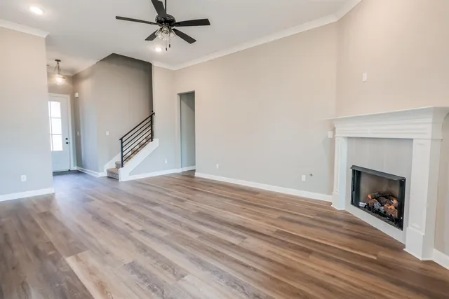 a kitchen with wooden floors and appliances