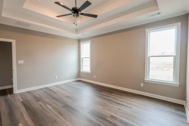 a view of a kitchen with a stove cabinets and wooden floor