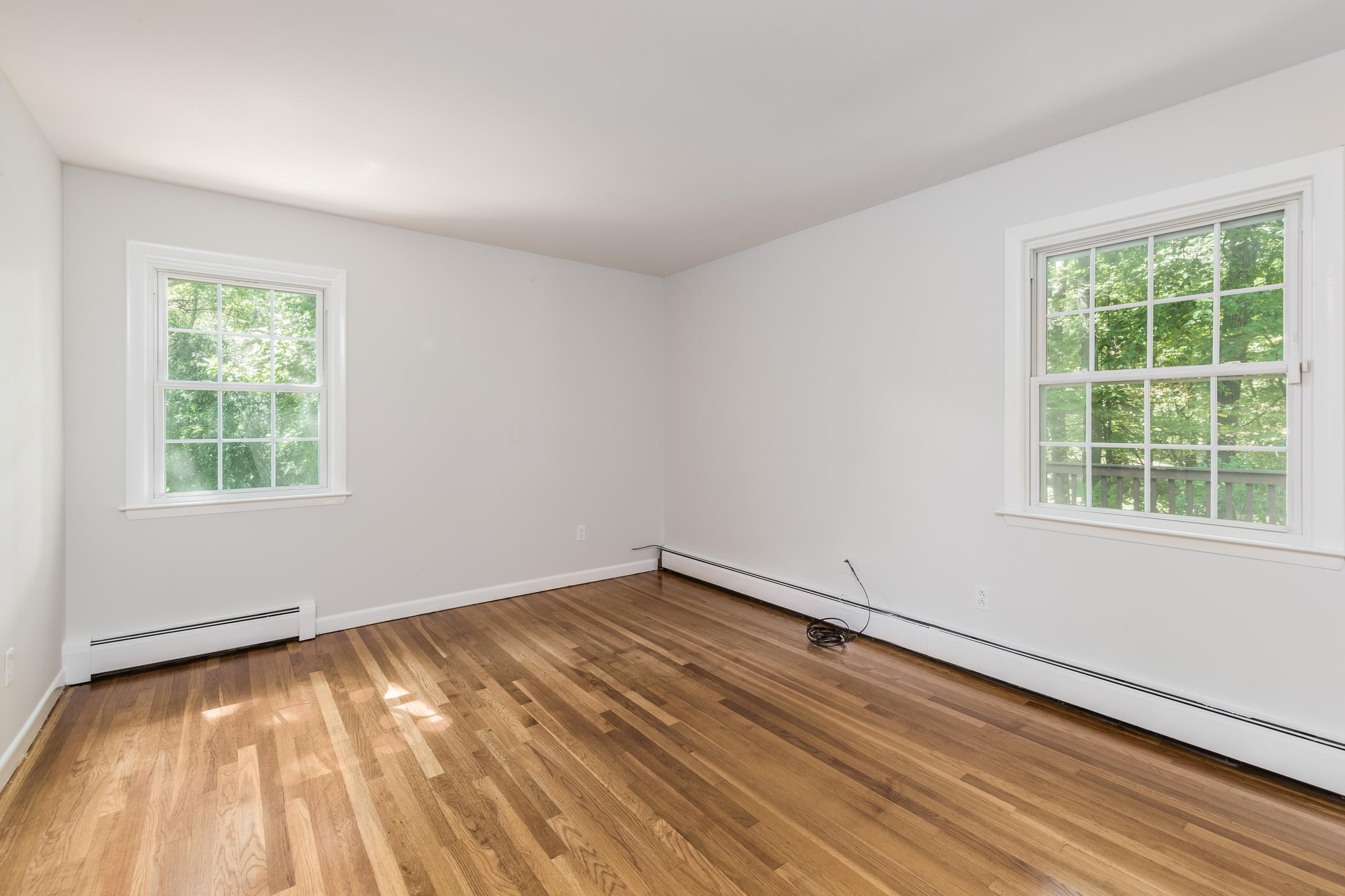 4 Littlebrook Road North Darien, CT 06820 - Photo 12 of 42 a view of an empty room with wooden floor and a window