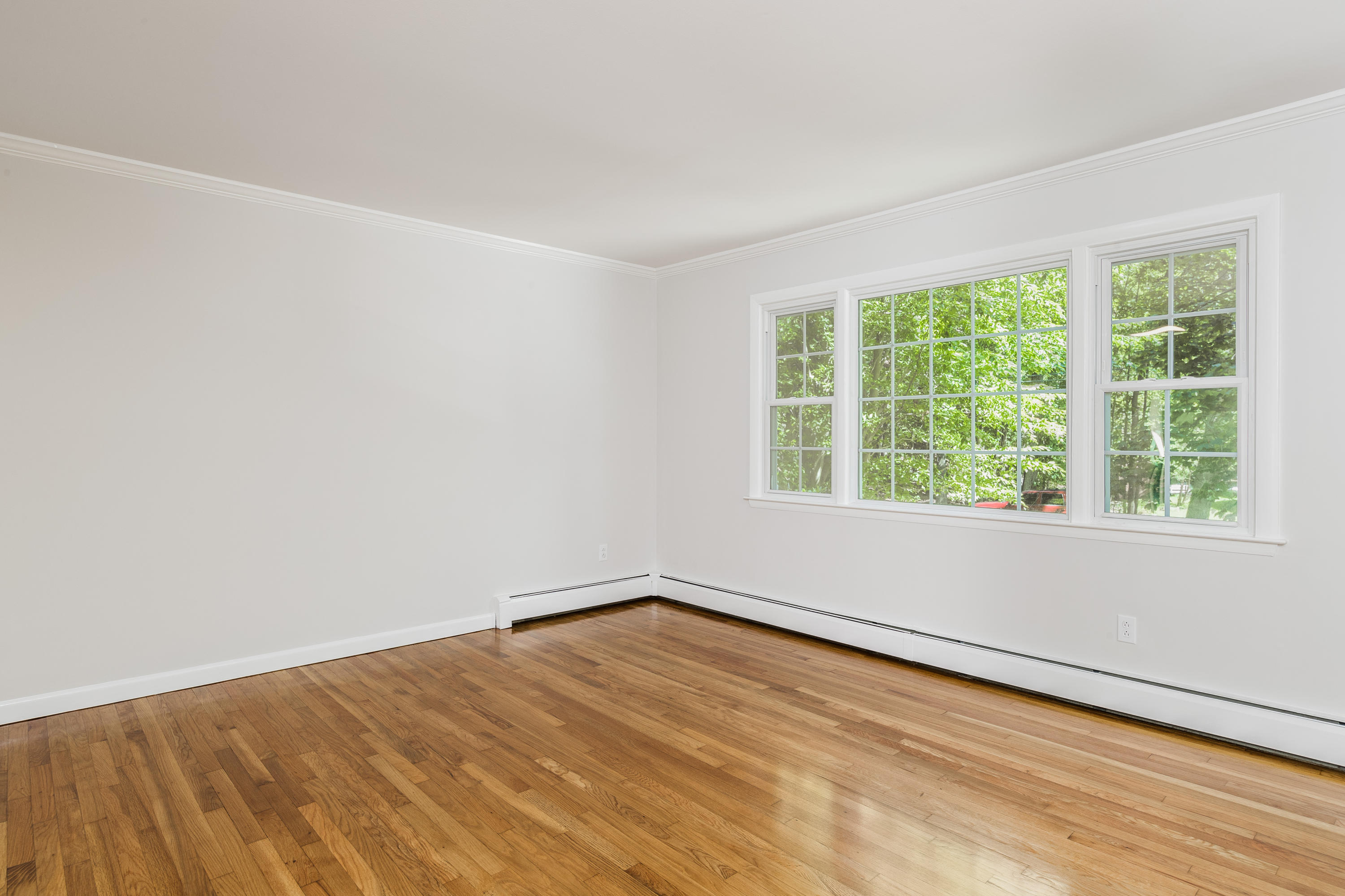 4 Littlebrook Road North Darien, CT 06820 - Photo 13 of 42 a view of an empty room with wooden floor and a window