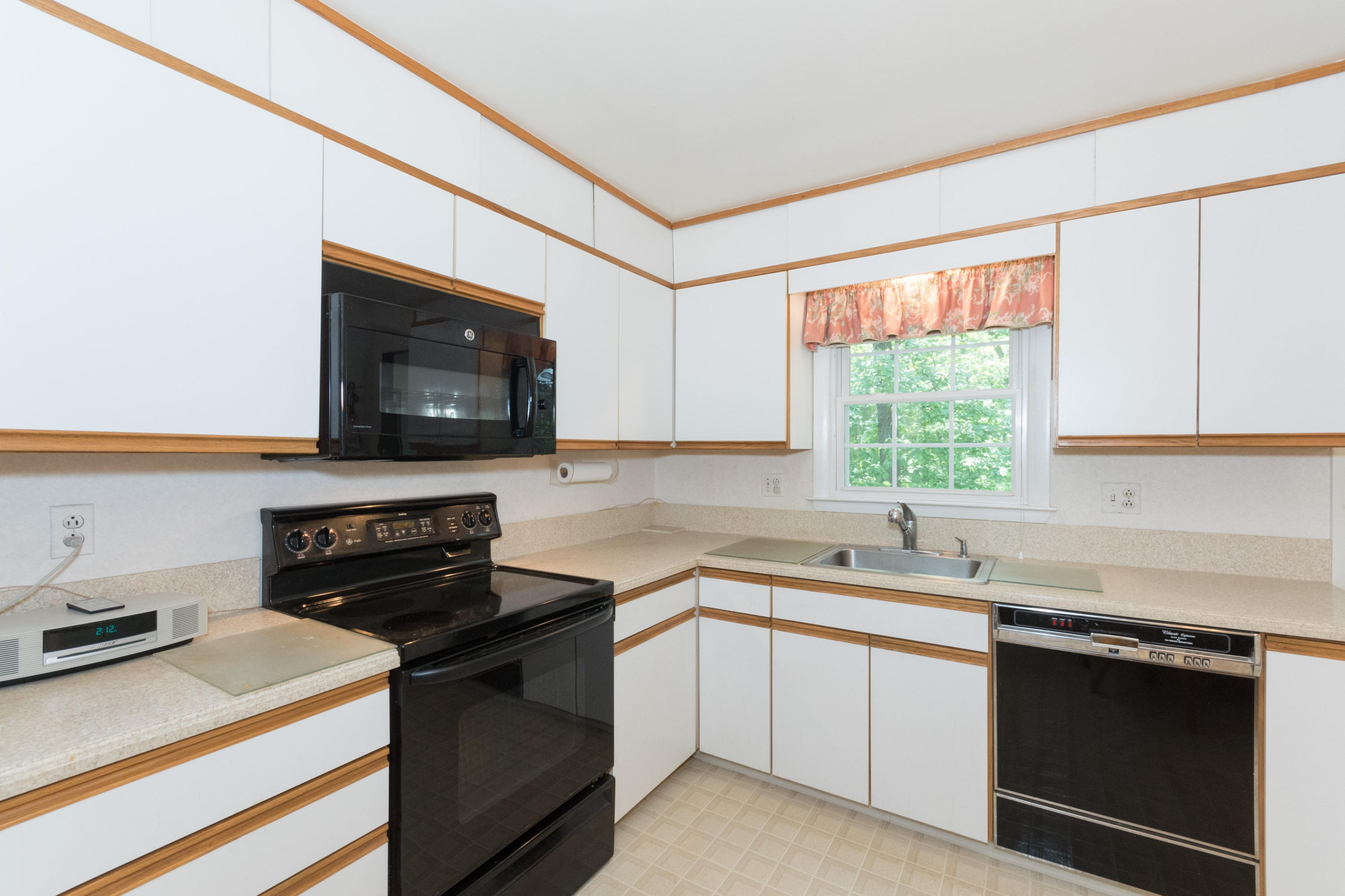 4 Littlebrook Road North Darien, CT 06820 - Photo 17 of 42 a kitchen with a sink stove and microwave