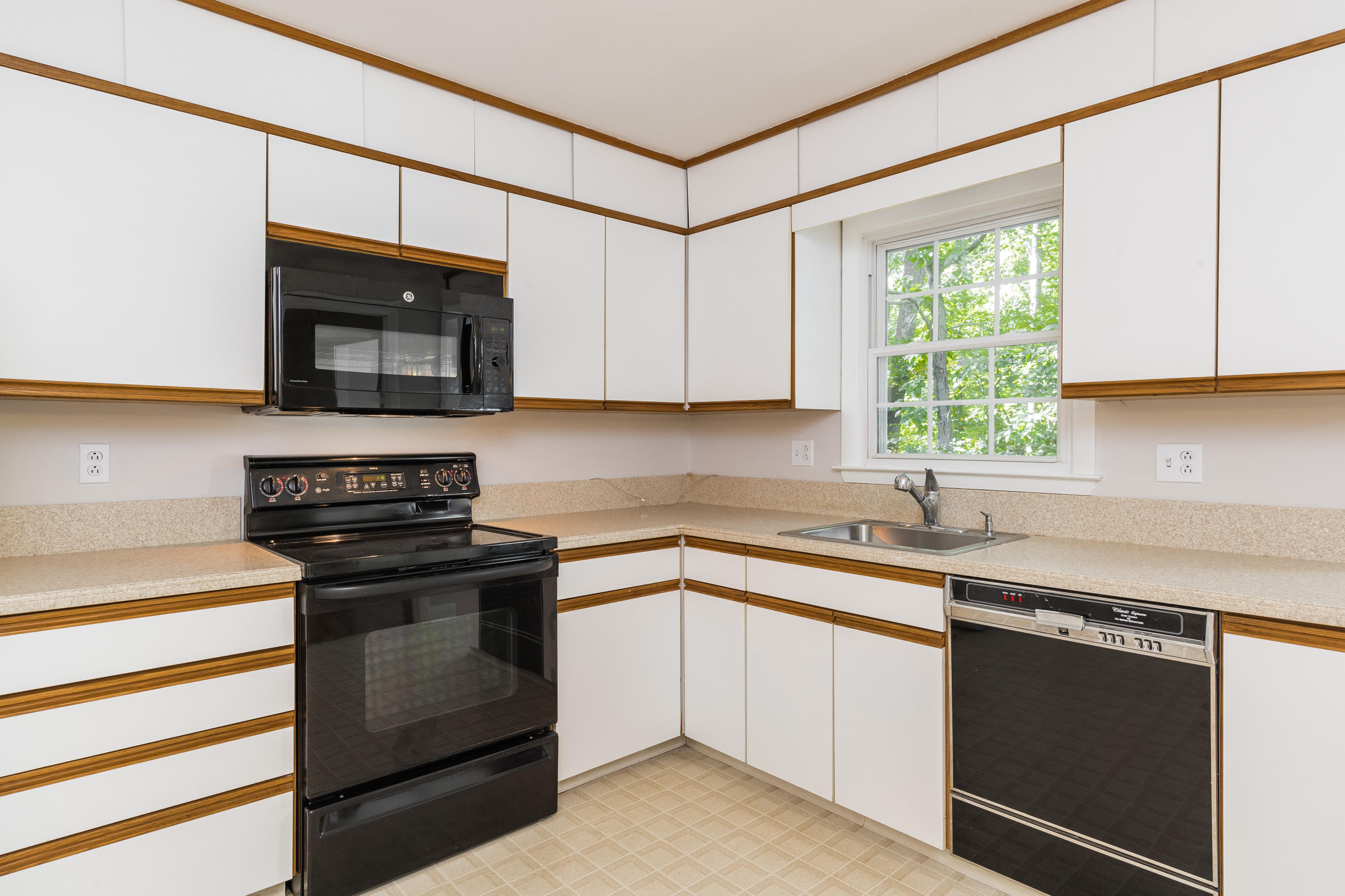 4 Littlebrook Road North Darien, CT 06820 - Photo 18 of 42 a kitchen with a sink stove and microwave