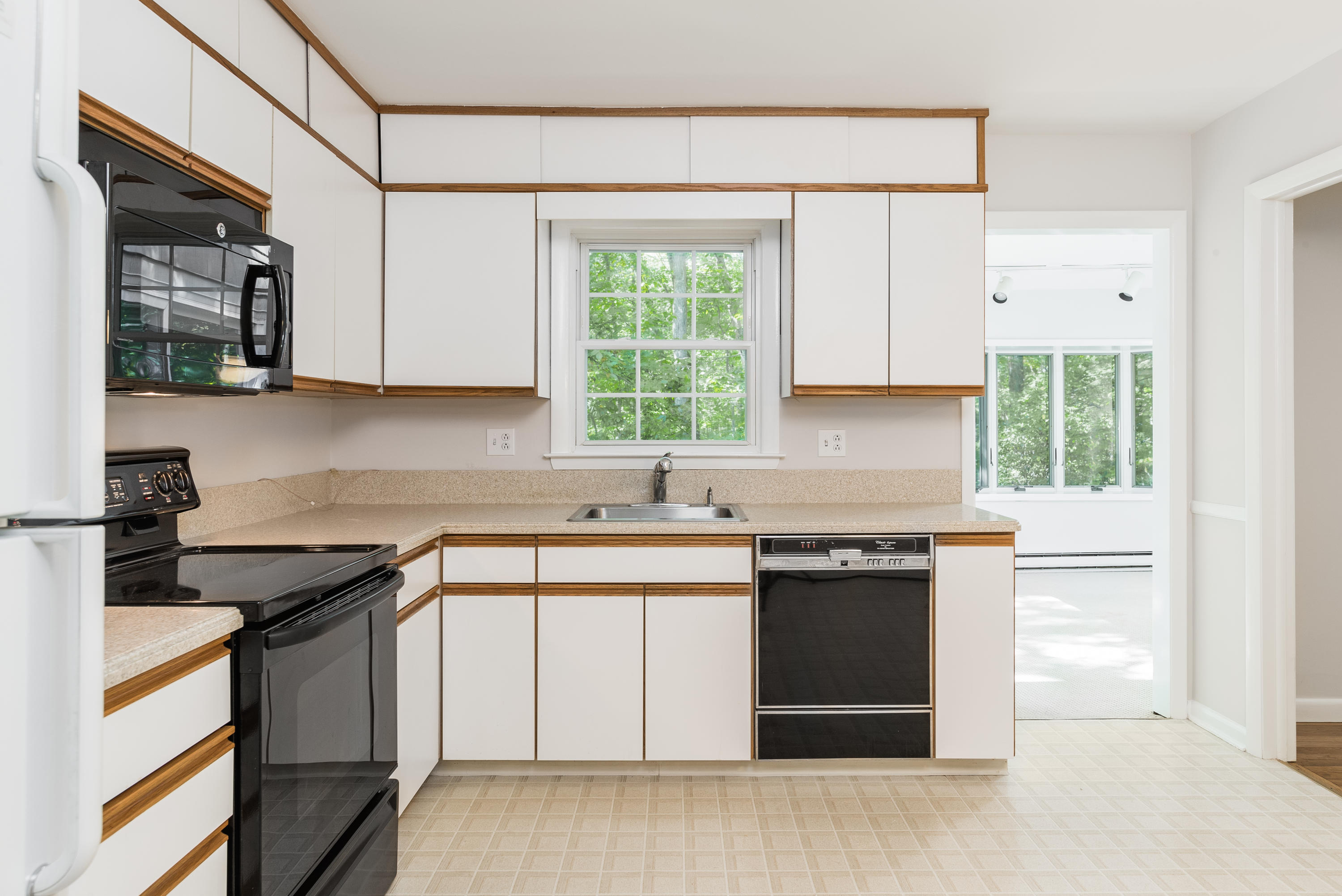 4 Littlebrook Road North Darien, CT 06820 - Photo 19 of 42 a kitchen with stainless steel appliances granite countertop a stove a sink and a microwave