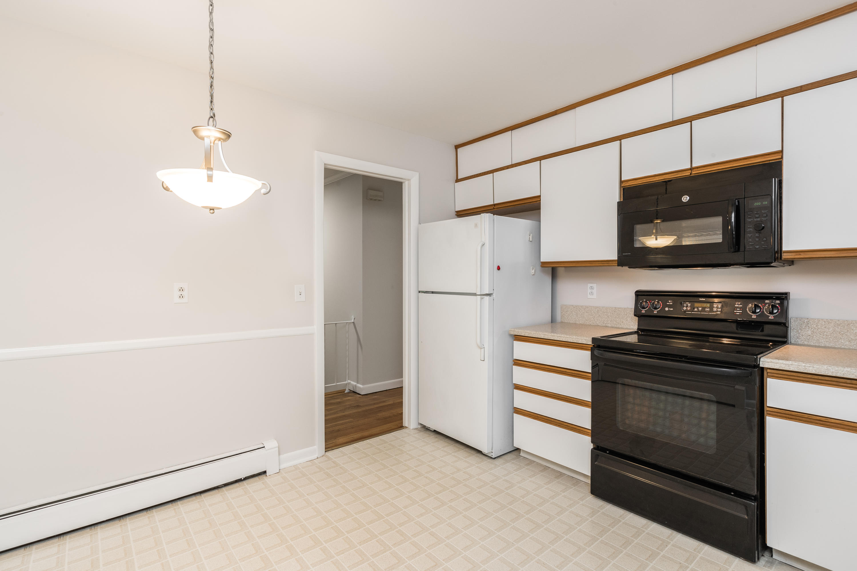 4 Littlebrook Road North Darien, CT 06820 - Photo 20 of 42 a kitchen with stainless steel appliances a refrigerator and a stove top oven