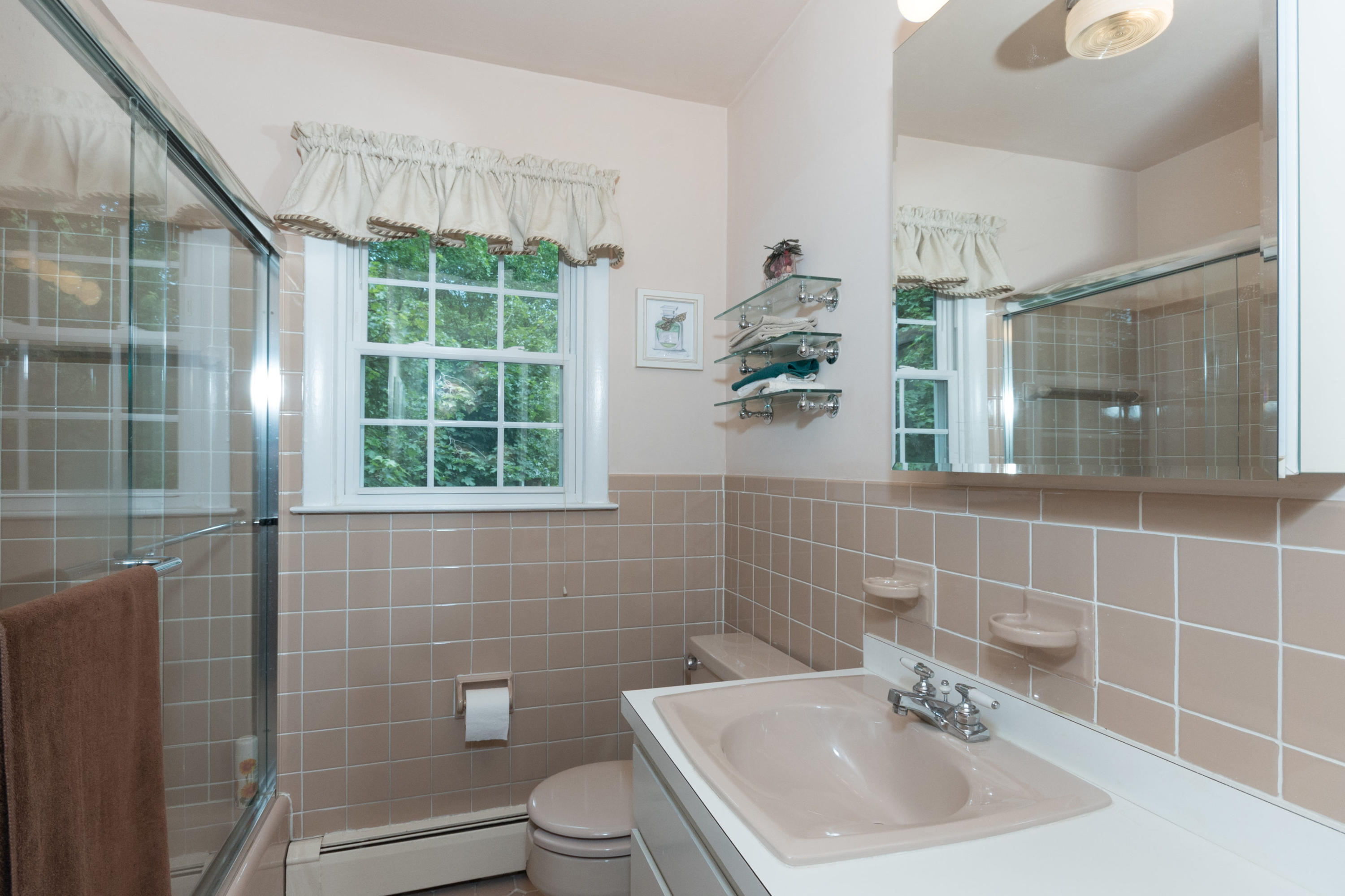 4 Littlebrook Road North Darien, CT 06820 - Photo 22 of 42 a bathroom with a sink a toilet and shower