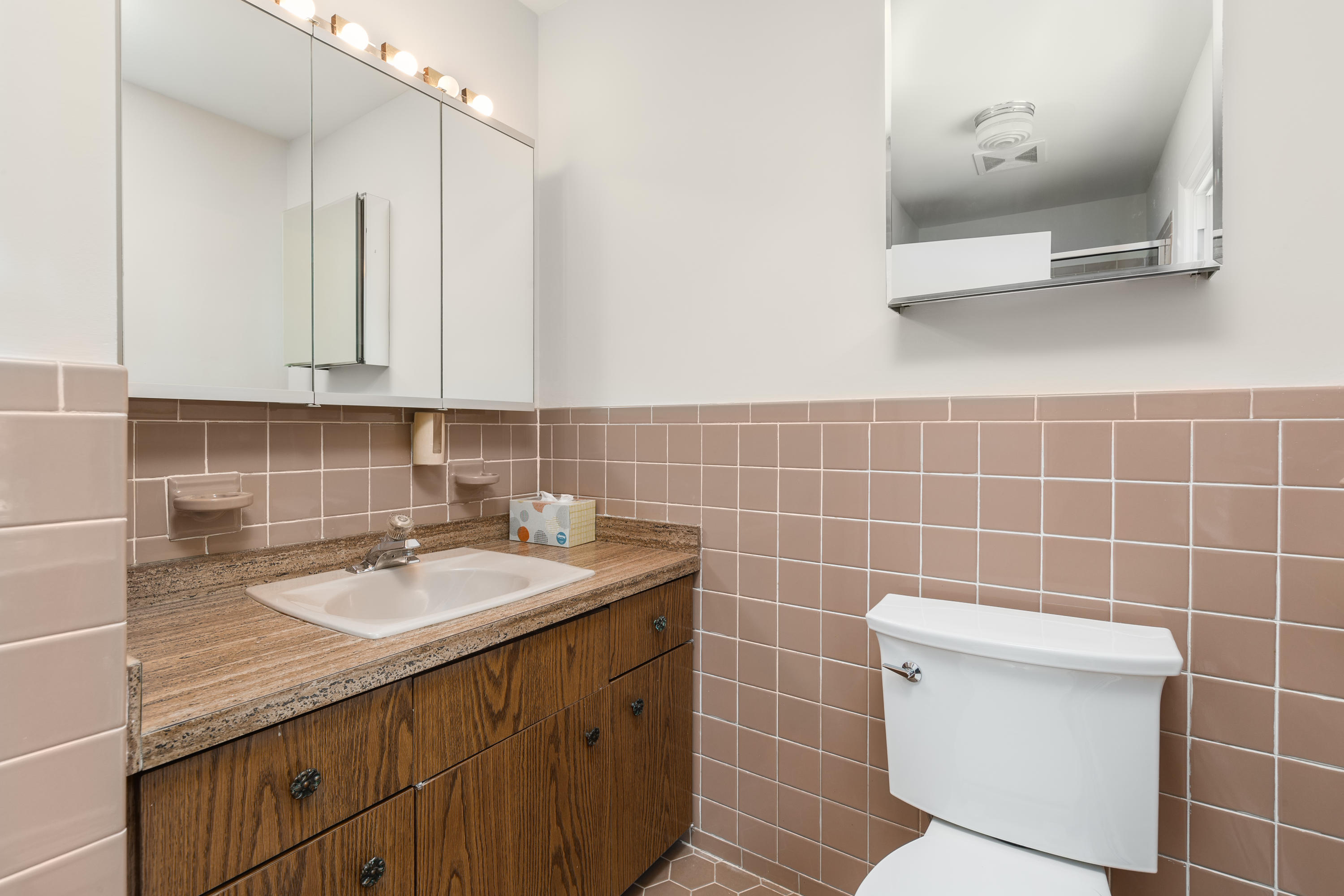 4 Littlebrook Road North Darien, CT 06820 - Photo 23 of 42 a bathroom with a sink a toilet and a mirror