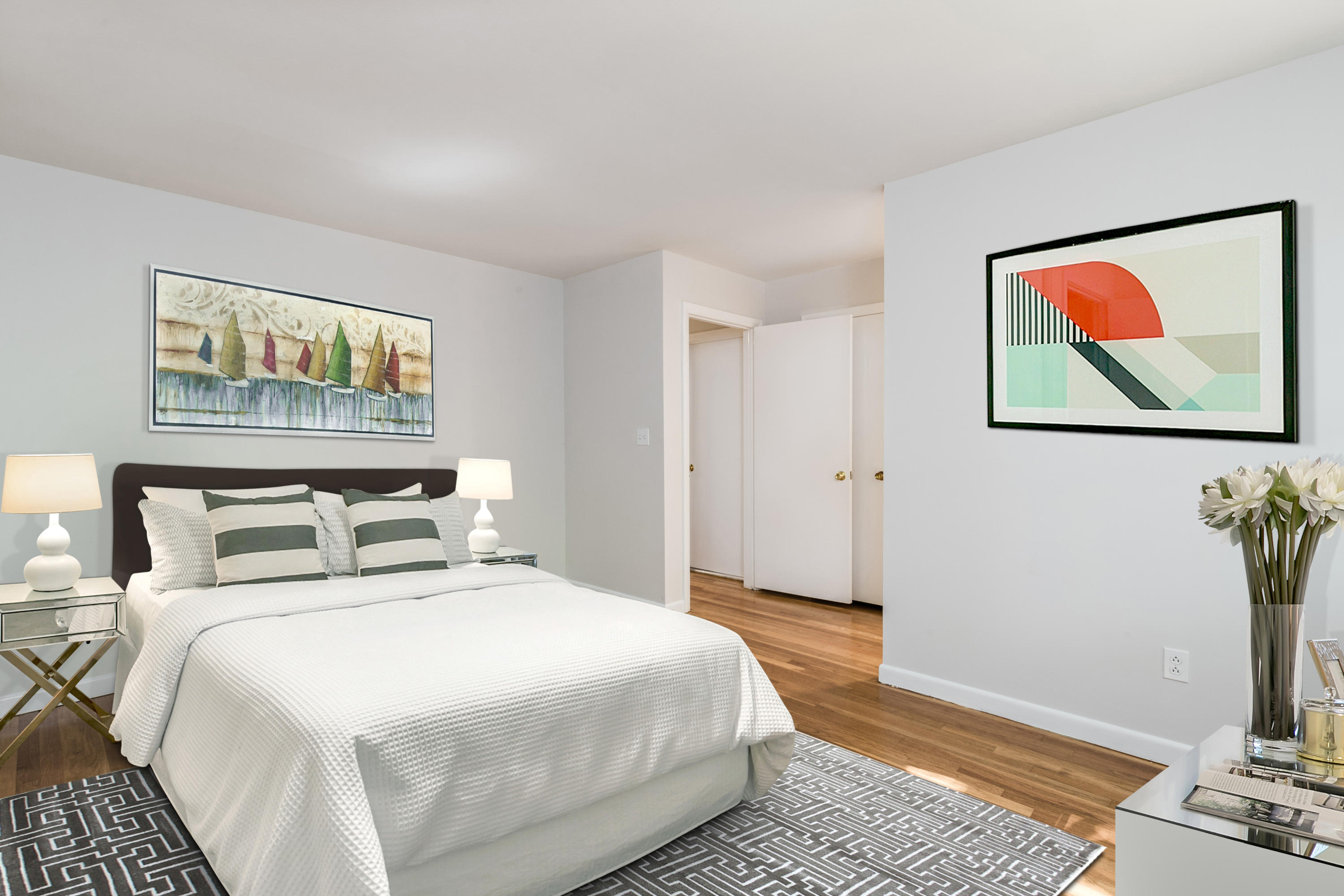 4 Littlebrook Road North Darien, CT 06820 - Photo 36 of 42 a bedroom with bed and wall painting with wooden floor