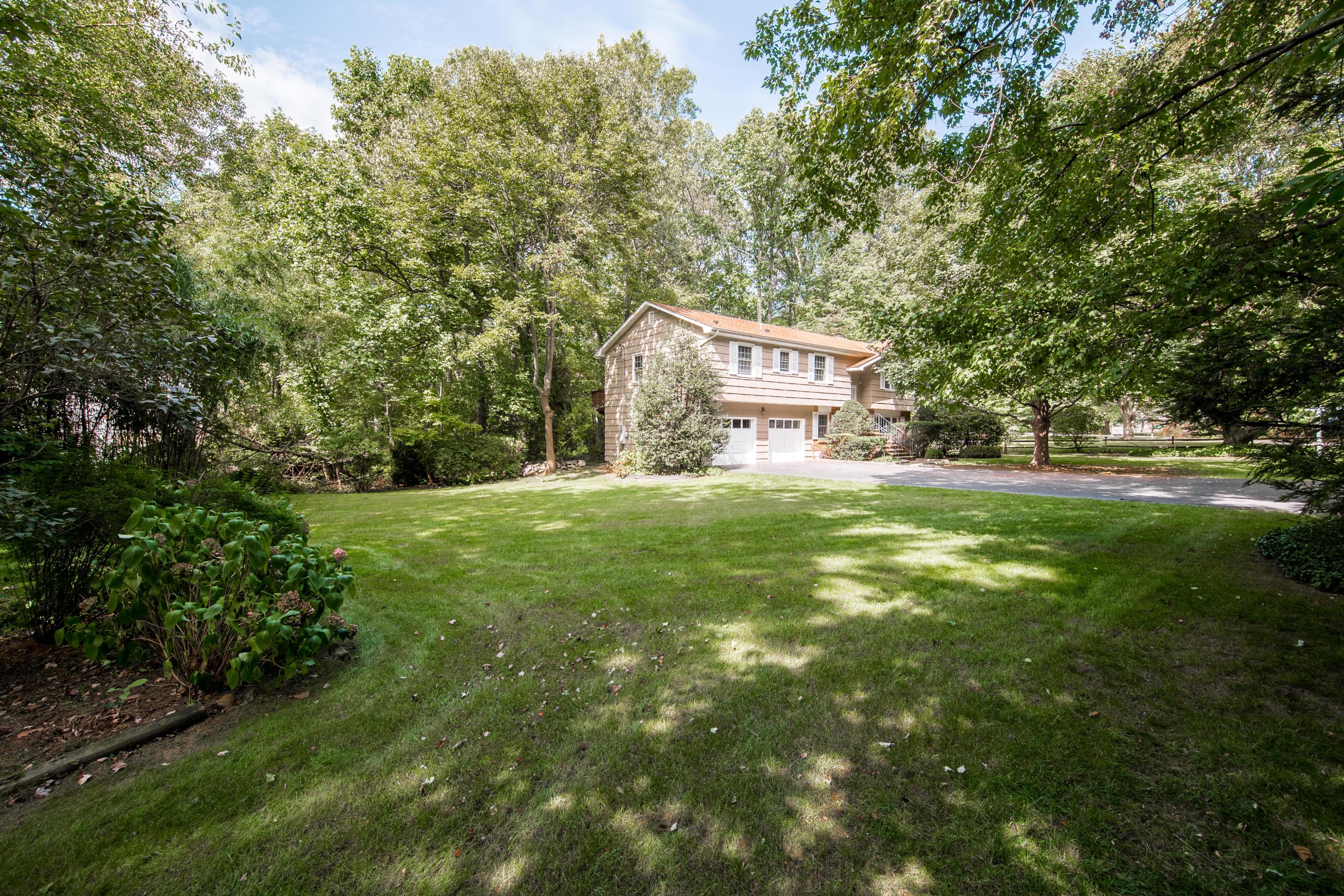 4 Littlebrook Road North Darien, CT 06820 - Photo 4 of 42 a view of a big yard with large trees