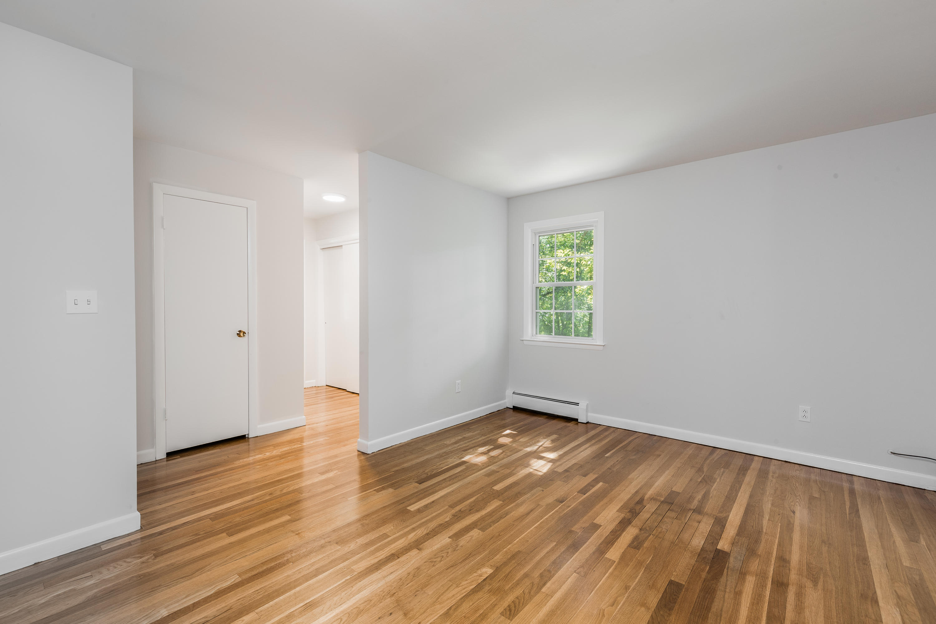 4 Littlebrook Road North Darien, CT 06820 - Photo 7 of 42 an empty room with wooden floor and windows