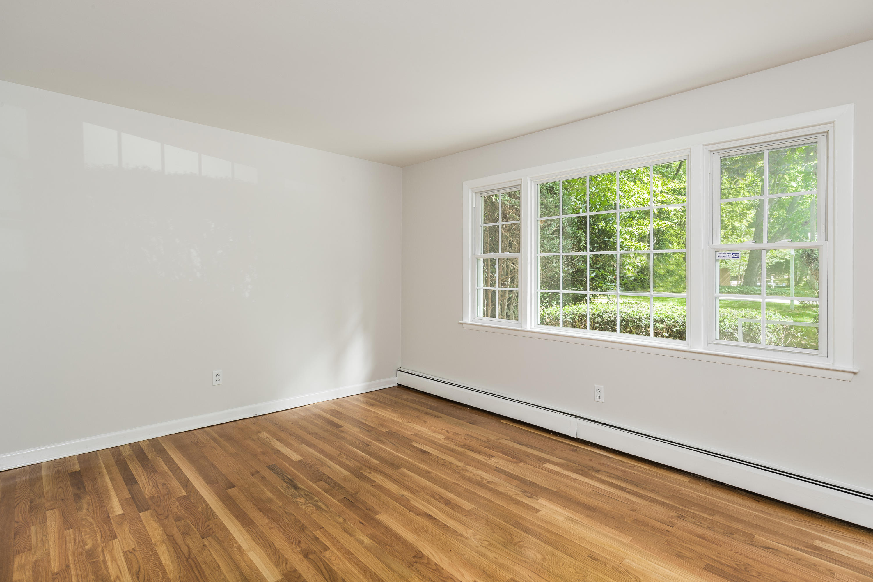 4 Littlebrook Road North Darien, CT 06820 - Photo 9 of 42 a view of an empty room with wooden floor and a window
