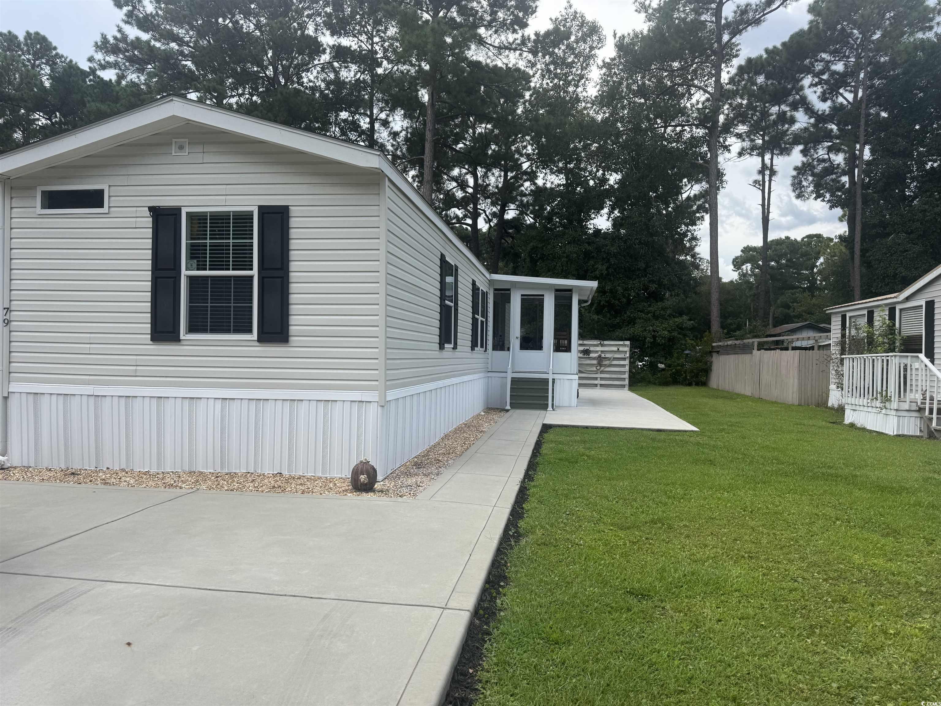 79 Offshore Drive Murrells Inlet, SC 29576 - Photo 25 of 31 View of property exterior with view of wooded area