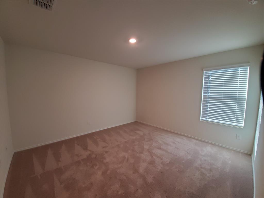 414 Sweetshade Lane Princeton, TX 75407 - Photo 4 of 10 a view of an empty room with a window