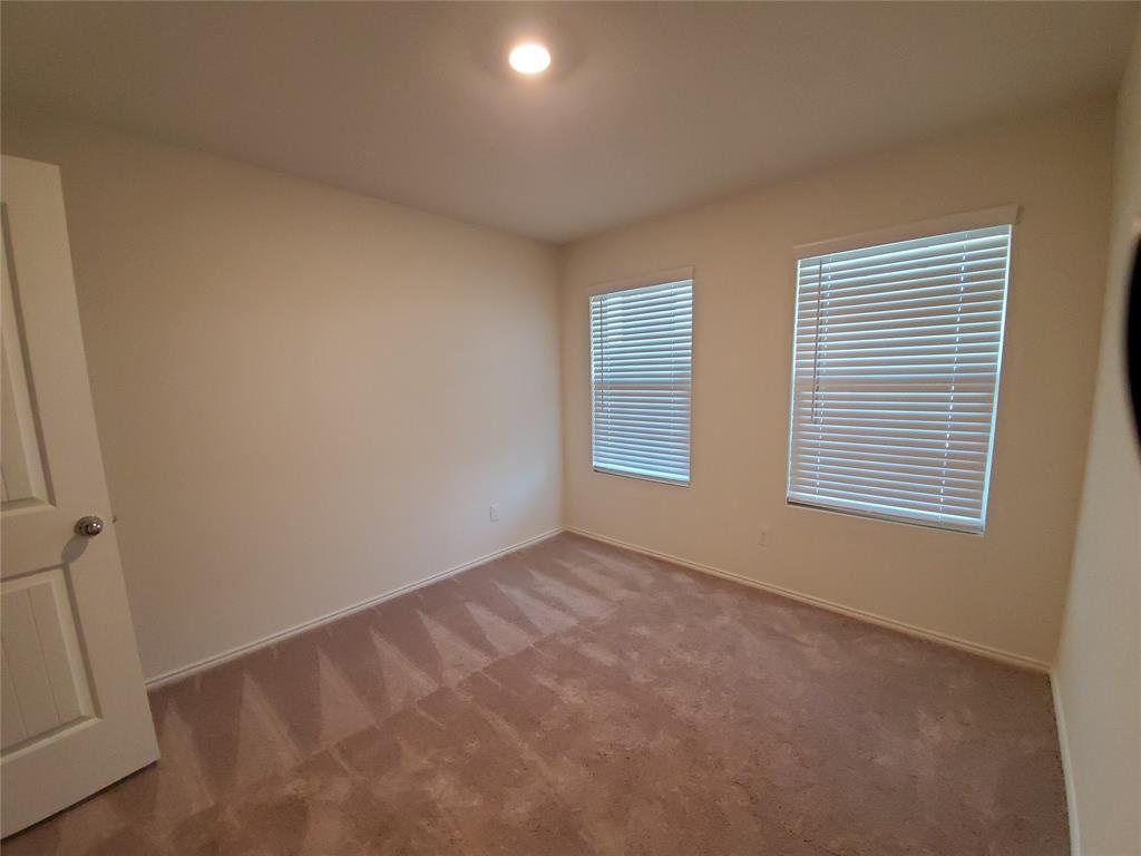 414 Sweetshade Lane Princeton, TX 75407 - Photo 8 of 10 a view of an empty room with a window