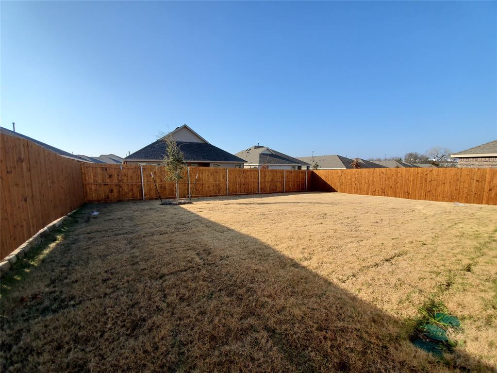 414 Sweetshade Lane Princeton, TX 75407 - Photo 9 of 10 a view of a house with a yard