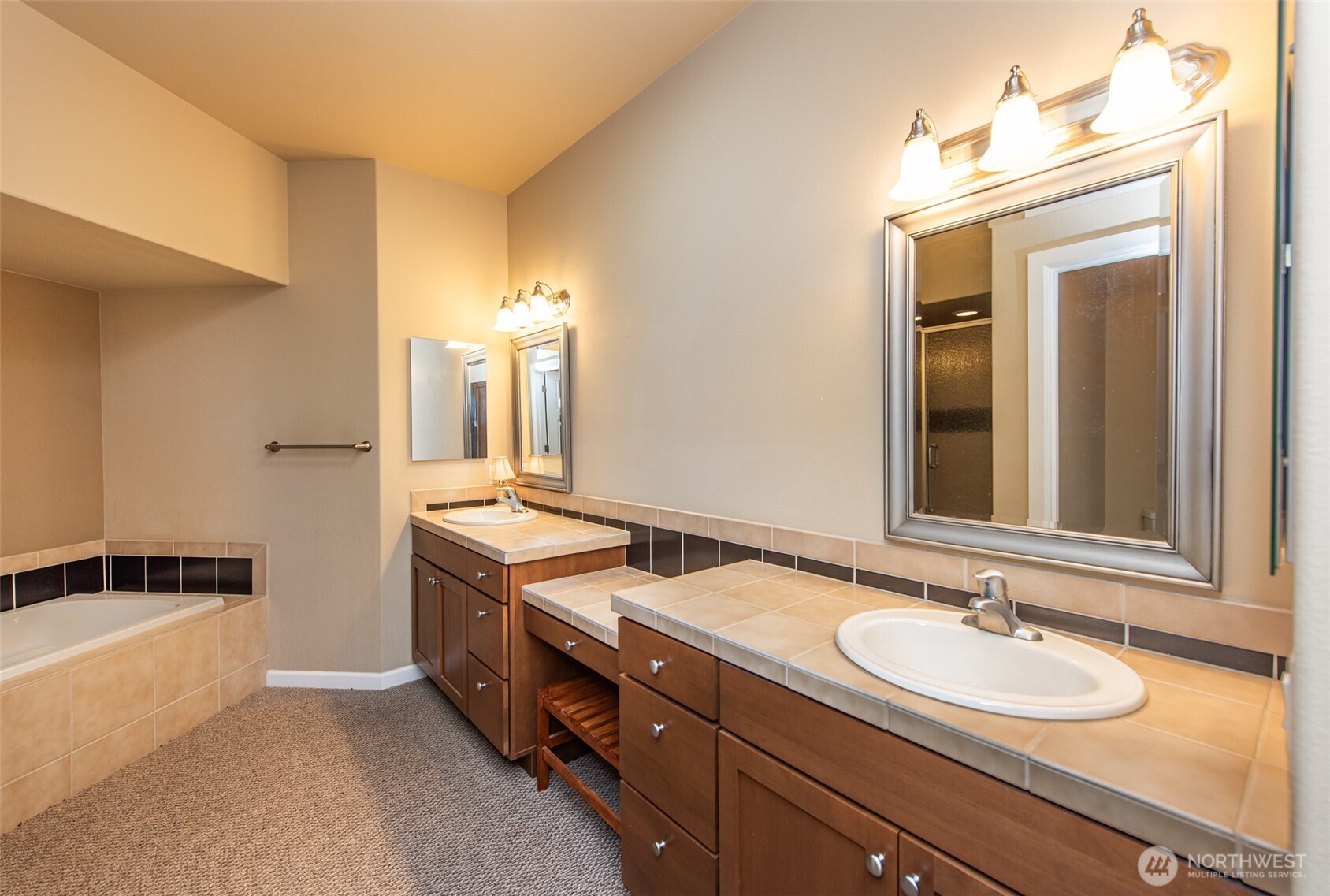 71 Mt Baker Drive Sequim, WA 98382 - Photo 11 of 25 a bathroom with a sink and a mirror