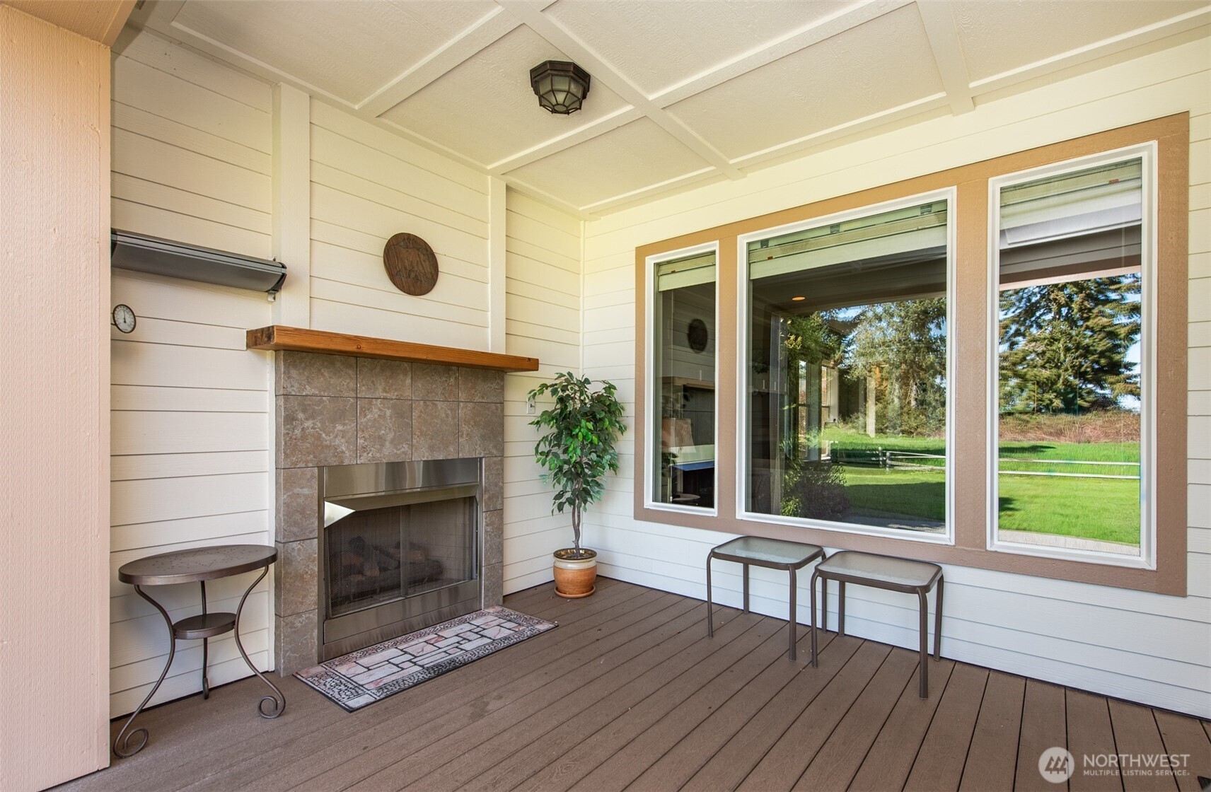 71 Mt Baker Drive Sequim, WA 98382 - Photo 18 of 25 a living room with a fireplace windows and a table
