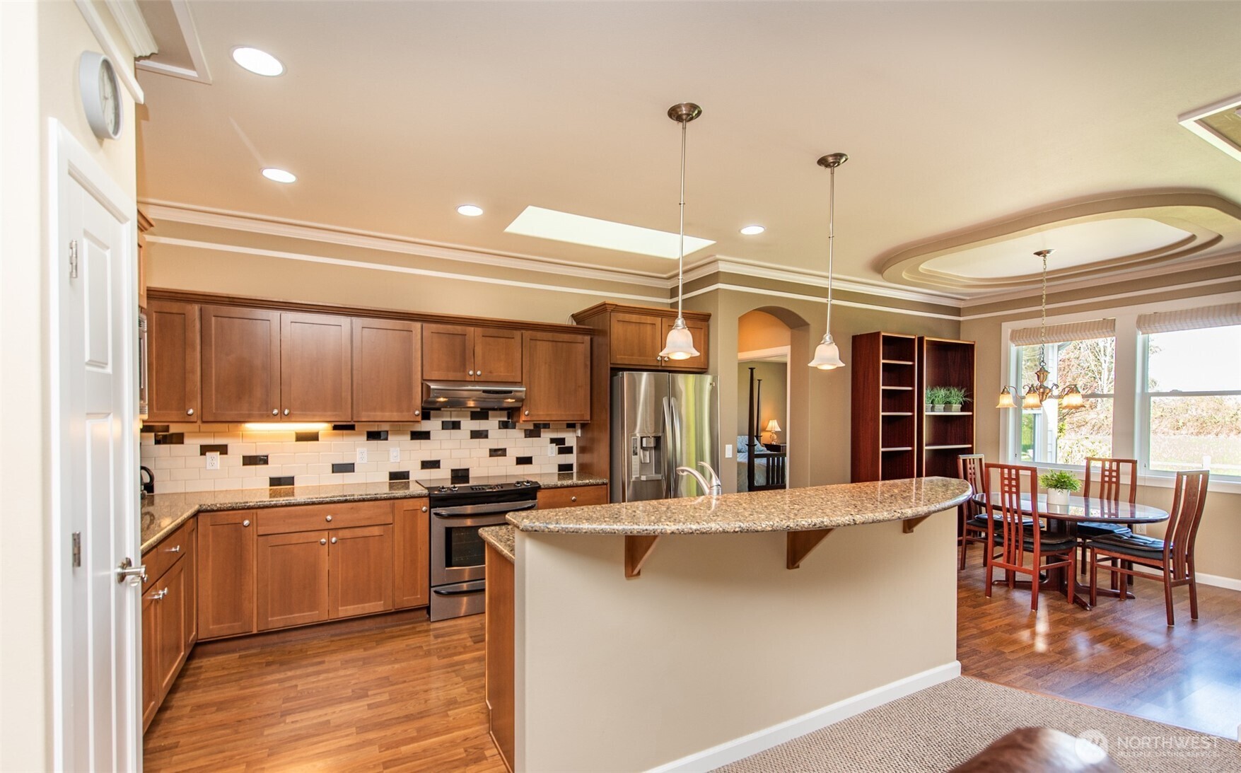 71 Mt Baker Drive Sequim, WA 98382 - Photo 4 of 25 a kitchen with stainless steel appliances kitchen island granite countertop a stove and a refrigerator