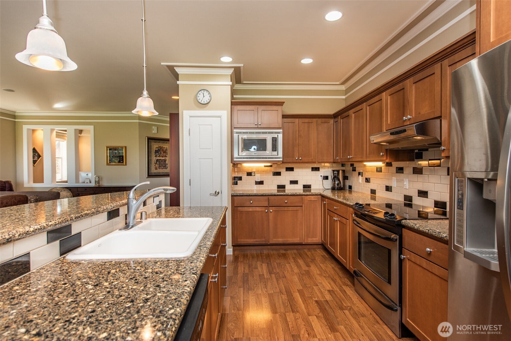 71 Mt Baker Drive Sequim, WA 98382 - Photo 5 of 25 a kitchen with stainless steel appliances granite countertop a sink stove and refrigerator