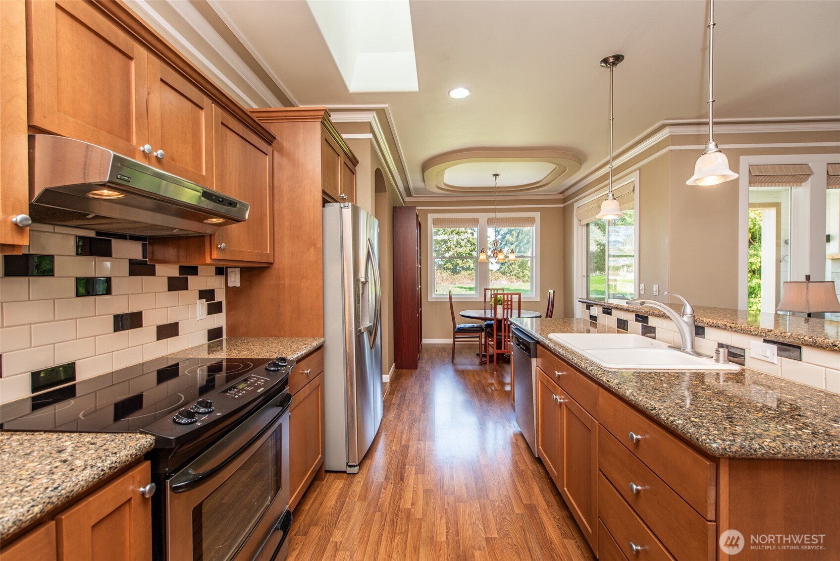 71 Mt Baker Drive Sequim, WA 98382 - Photo 6 of 25 a kitchen with stainless steel appliances granite countertop a sink stove and refrigerator