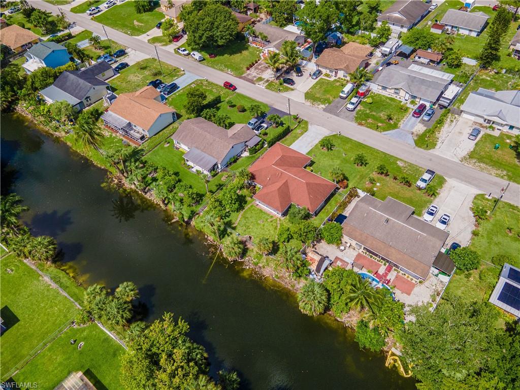 2100 55th Street Southwest Naples, FL 34116 - Photo 10 of 50 an aerial view of a houses with a lake view