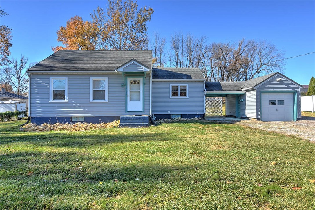 1765 South Fairview Avenue Decatur, IL 62521 - Photo 1 of 24 a front view of a house with a garden