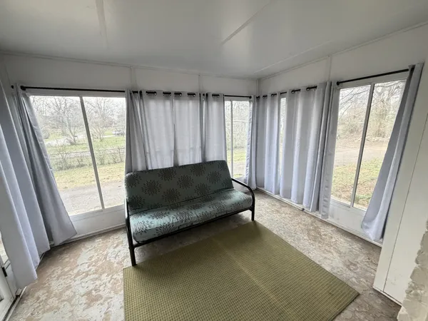 an entryway in a hall with wooden floor