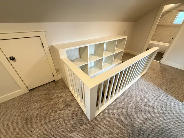 an entryway with a rug