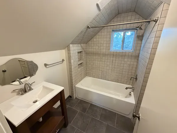 a bathroom with a toilet and a bathtub