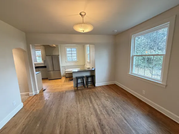 a view of a workspace a window and wooden floor
