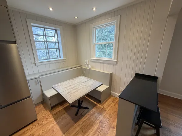 a kitchen with stainless steel appliances granite countertop a refrigerator a stove and a sink