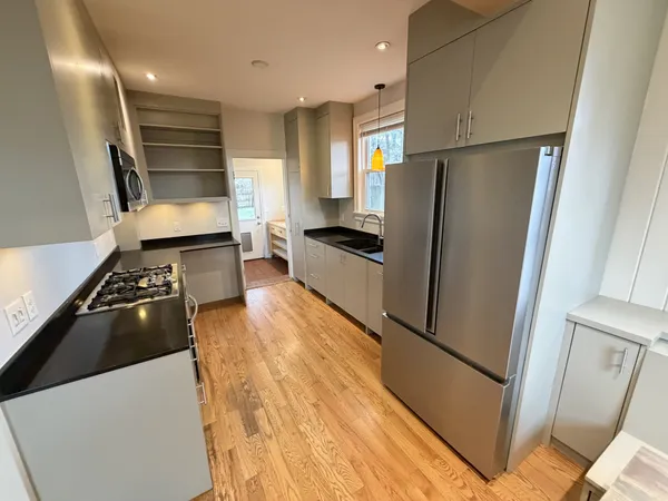 a kitchen with stainless steel appliances a refrigerator and a sink