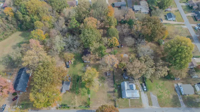 a aerial view of a house with a yard