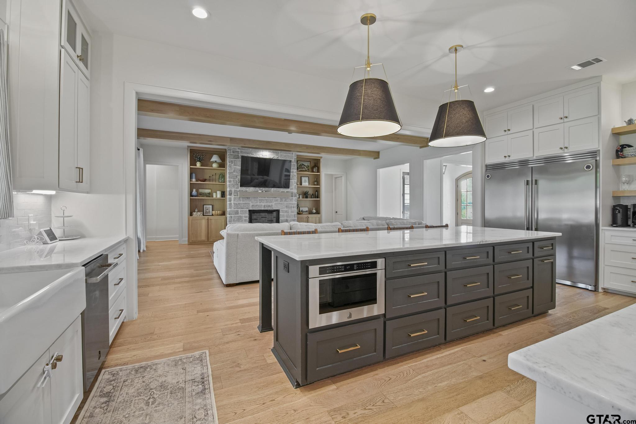1242 Colt Lane Tyler, TX 75703 - Photo 15 of 47 a kitchen with stainless steel appliances granite countertop a stove and a sink