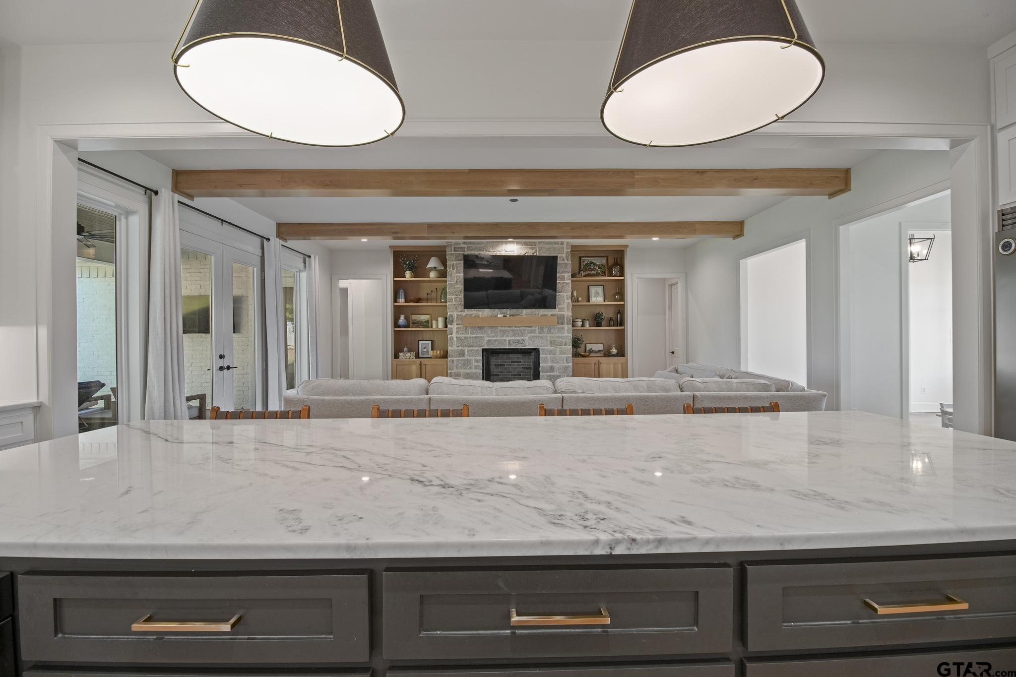1242 Colt Lane Tyler, TX 75703 - Photo 16 of 47 a view of living room with granite countertop furniture and fireplace