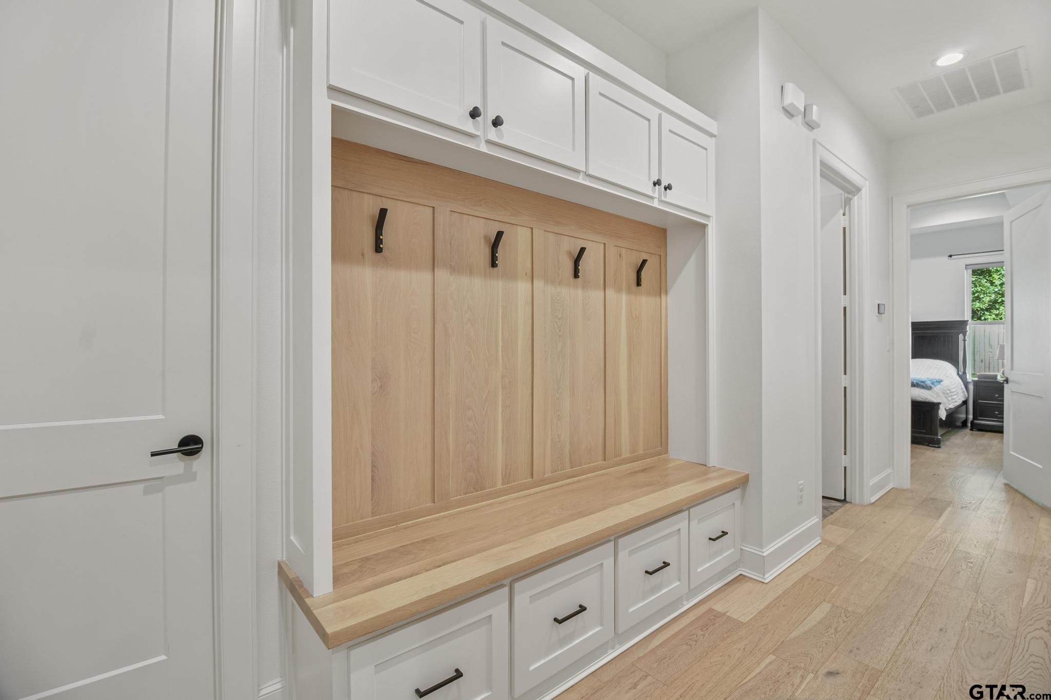 1242 Colt Lane Tyler, TX 75703 - Photo 17 of 47 a view of a kitchen with wooden cabinets