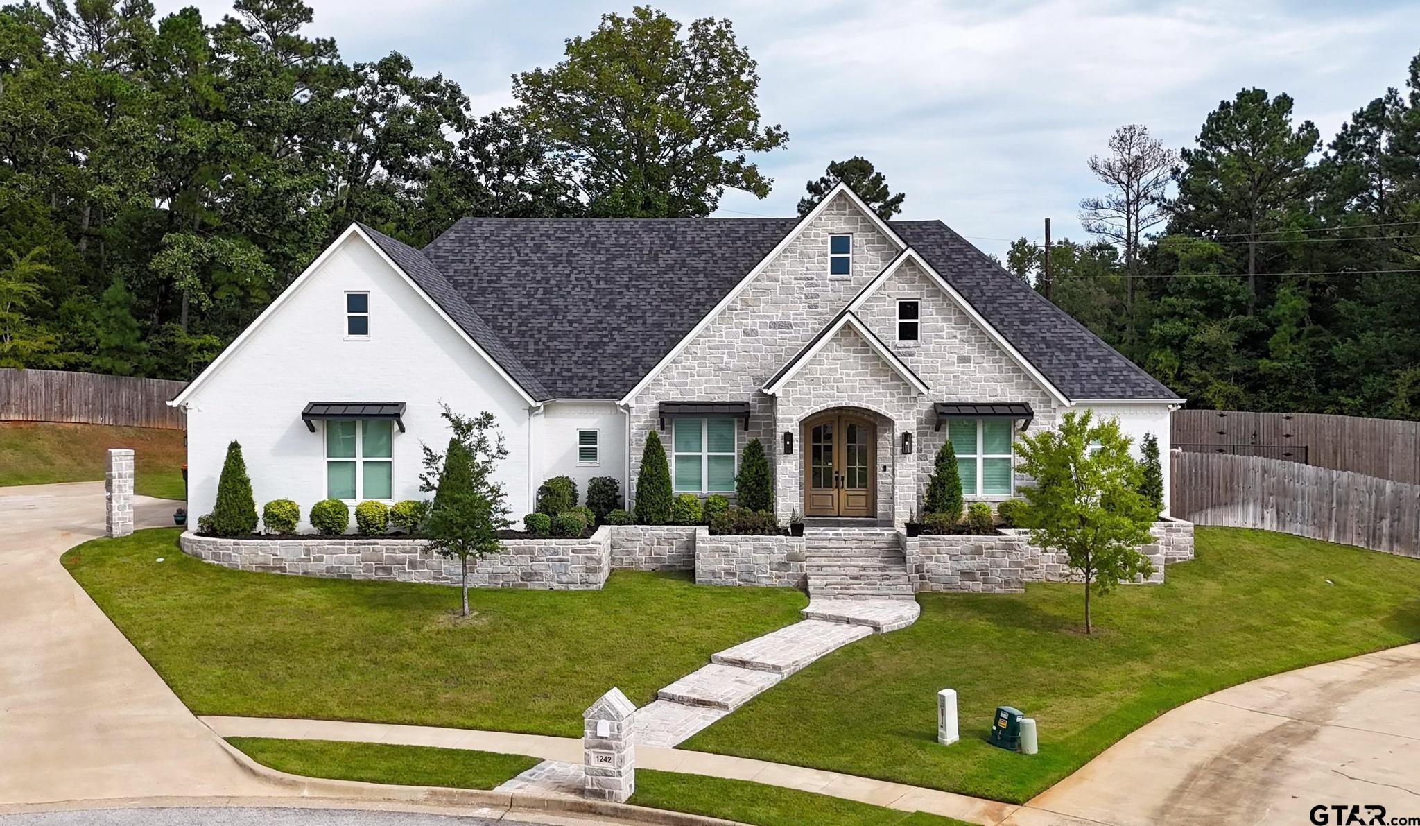 1242 Colt Lane Tyler, TX 75703 - Photo 2 of 47 a front view of house with garden