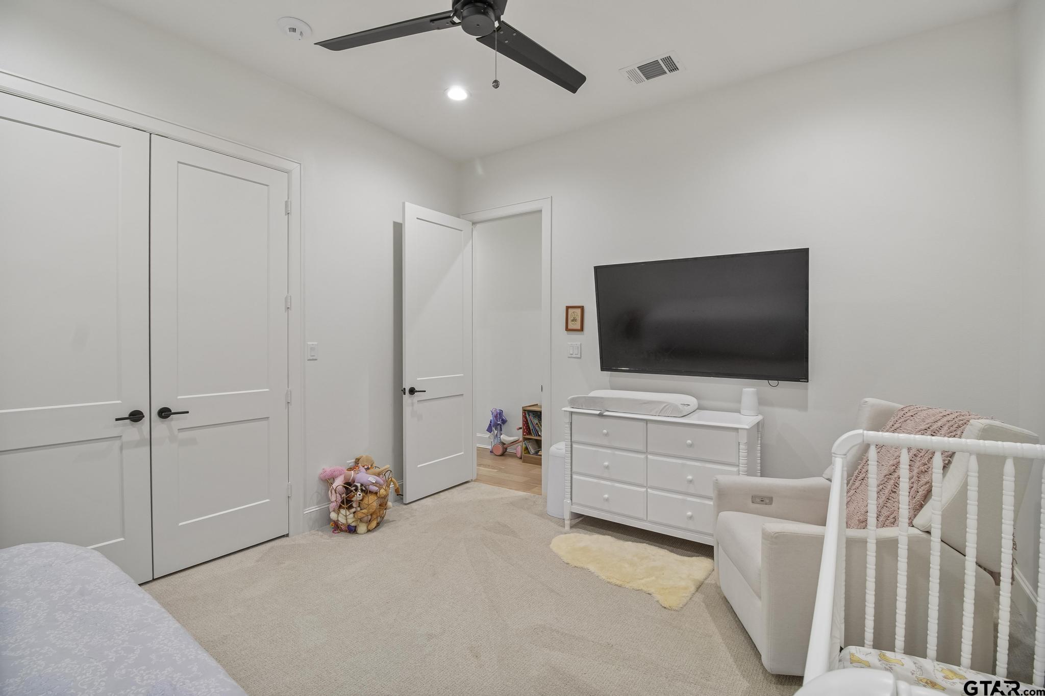 1242 Colt Lane Tyler, TX 75703 - Photo 29 of 47 a living room with furniture and a flat screen tv